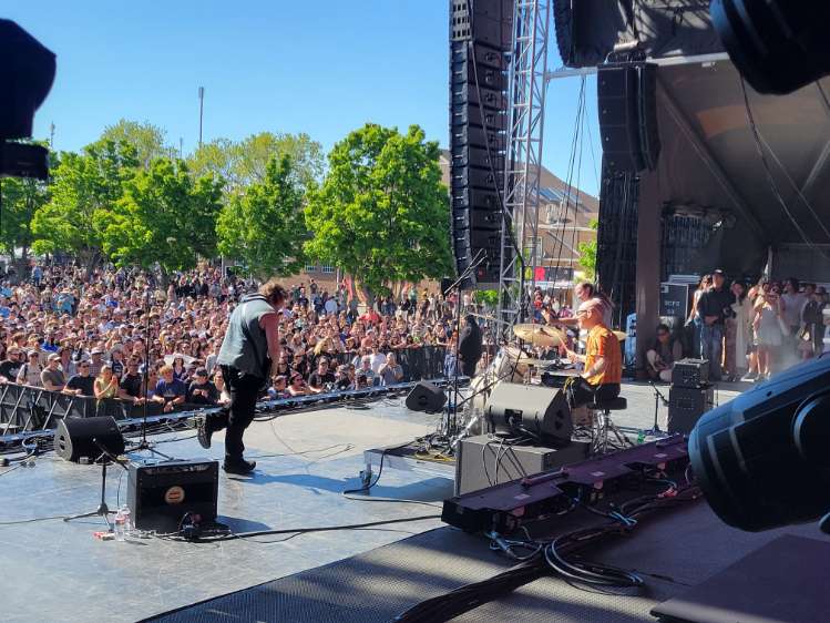Indie band performing live on stage with full AV and lighting setup at Kilby Block Party 2024.